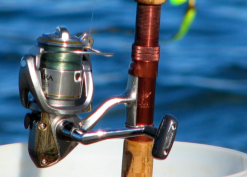 A close-up of a fishing reel